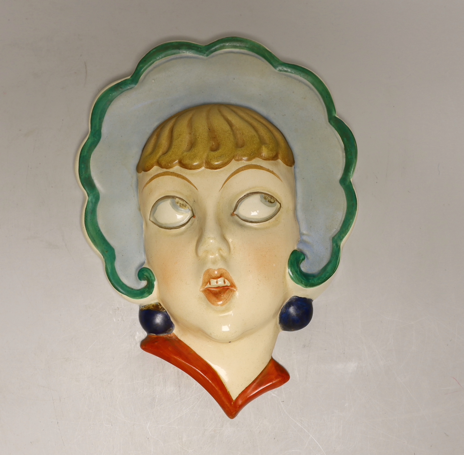 A Czechoslovakian Art Deco face mask, 22cm